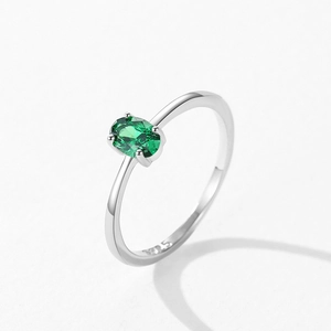 S925 sterling silver ring with oval green emerald zircon in a four-prong setting