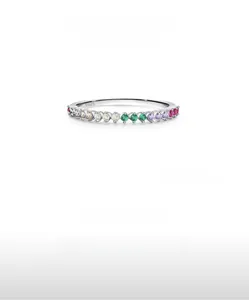 Detailed close-up of S925 sterling silver ring with rainbow colored cubic zirconia stones