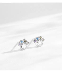 Detailed close-up of S925 sterling silver paw print earrings with rainbow cubic zirconia