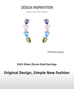 Detail of S925 silver rainbow zircon stud earrings with pear-cut gemstones in a curve