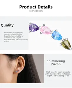 Detailed close-up of rainbow teardrop zirconia earrings made of polished 925 silver
