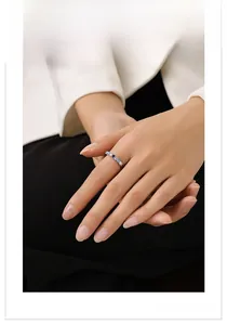Close-up of S925 silver ring on model finger with blue and white zircons