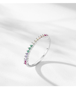 Detail of S925 sterling silver ring with rainbow zircon stones in prong setting