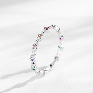 S925 silver eternity ring with colorful rainbow cubic zirconia in a 45-degree view
