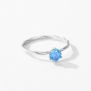 S925 sterling silver six-prong ring featuring a blue round cubic zirconia and twisted band