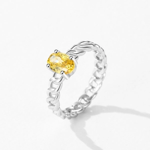 Elegant S925 silver ring with rope texture and oval yellow gemstone in a 45-degree view