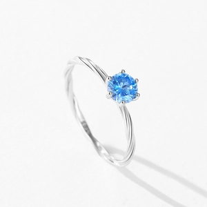 S925 sterling silver ring with blue zircon, six-prong setting and twisted rope band