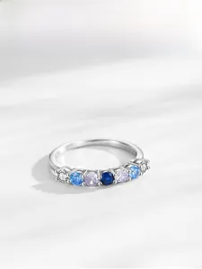 Macro view of S925 sterling silver ring with seven gradient blue and purple zircons