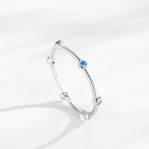 Minimalist S925 sterling silver ring with colorful zircons on a clean white background