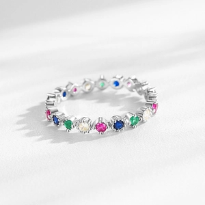 Elegant S925 sterling silver eternity ring featuring colorful rainbow zircon stones in claw setting