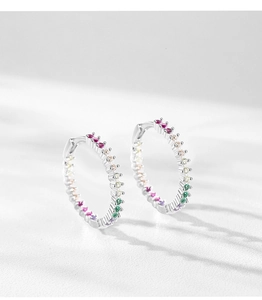 Macro shot of S925 sterling silver hoop earrings with rainbow gradient cubic zirconia