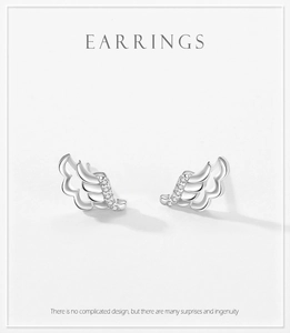 Close-up of S925 sterling silver angel wing stud earrings with micro-inlaid zircon stones