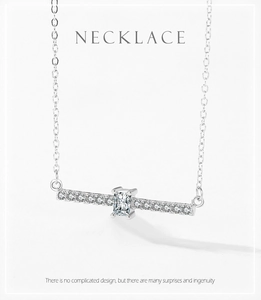 Macro detail of S925 silver necklace featuring a geometric bar pendant with radiant cut diamond