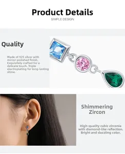 Macro detail of S925 sterling silver earrings with blue, pink and green zircon stones