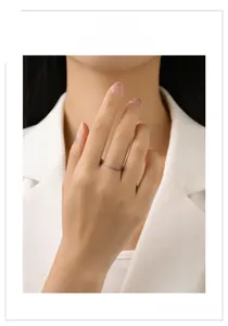 Close-up of a silver crown ring with colorful teardrop stones worn on a model finger
