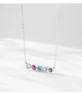 Detailed macro view of S925 silver necklace featuring multi-colored gemstone pendant