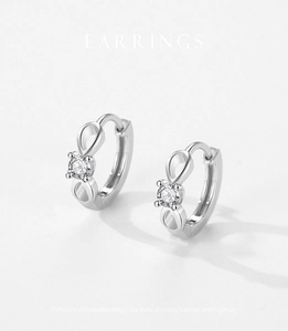 Detailed close-up of S925 sterling silver hoop earrings with infinity design and zircon