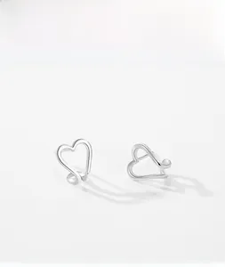 Detailed view of S925 sterling silver hollow heart stud earrings with a minimalist design