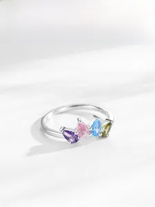 Detailed view of S925 silver crown ring with four colorful pear-shaped zirconia stones