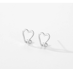 Detailed macro view of S925 sterling silver hollow heart-shaped minimalist ear cuff