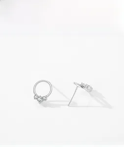 Detailed view of S925 sterling silver round stud earrings with three micro-set zircons