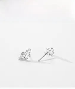 Macro shot of S925 sterling silver angel wing earrings with micro-inlaid zircon detail