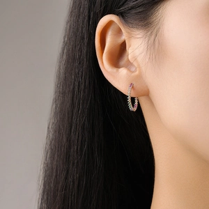 S925 sterling silver hoop earrings with multicolored zircon stones worn by a model