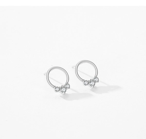 Close-up of S925 sterling silver earrings featuring three curved inset zircon stones