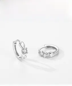 Detail of silver S925 infinity hoop earrings with sparkling micro-inlaid zircon stones