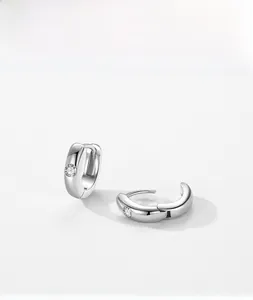 Detail shot of S925 sterling silver hoop earrings with clear round cubic zirconia stones