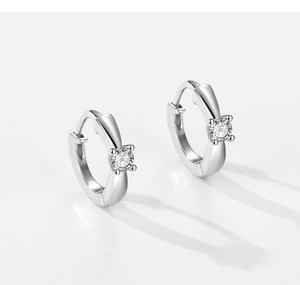 Close-up of S925 silver hoop earrings featuring clear zircon stones in four-prong settings