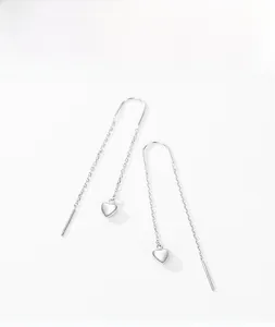 Close-up of S925 sterling silver heart tassel ear threads with polished finish
