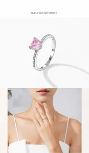 Close-up of pink heart-cut zircon ring with pavé stones and model wearing shot