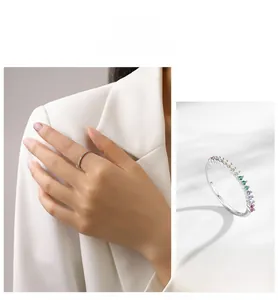 Detail of S925 silver ring featuring rainbow cubic zirconia in a slim stackable design