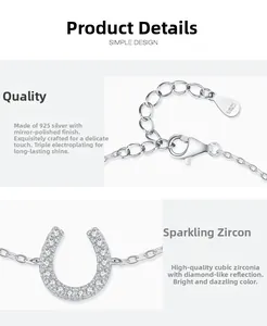 Macro detail of S925 sterling silver horseshoe charm with pave-set cubic zirconia stones