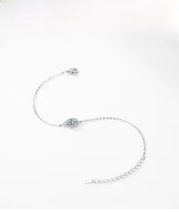 Macro view of S925 sterling silver teardrop bracelet with pear-cut cubic zirconia stones