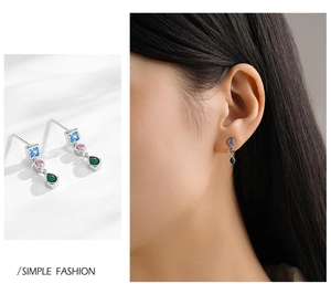 Detail of S925 silver earrings featuring three vertical colorful geometric zircon stones