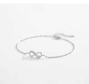 Close-up of S925 sterling silver infinity bracelet with white zircon pave setting