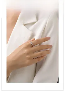 Close-up of S925 sterling silver ring with pear-shaped cubic zirconia on hand
