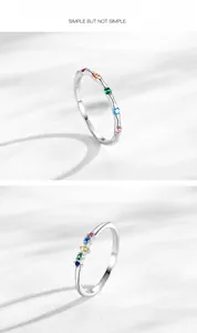 Details van S925 zilveren ringen met regenboog zirkonia en golvende ontwerppatronen