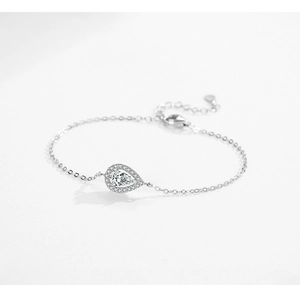 Macro shot of s925 silver bracelet featuring pear-shaped halo zircon and fine O-chain link