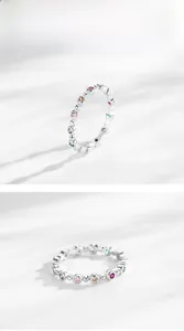 Macro detail of S925 sterling silver ring with colorful pave rainbow zircons
