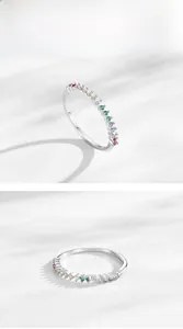 Detailed view of S925 silver ring featuring half-band rainbow cubic zirconia stones