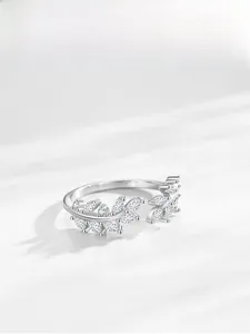 Macro detail of S925 silver leaf ring featuring marquise-cut sparkling cubic zirconia stones