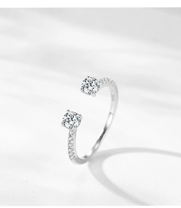 Macro shot of S925 sterling silver stamp on dual-stone open ring with cubic zirconia