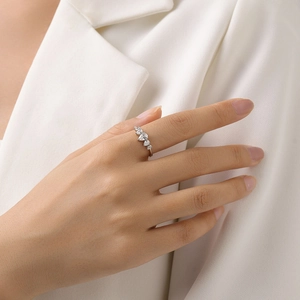 Elegant S925 sterling silver ring with five pear-cut zircon stones on model's finger