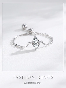 Detailed view of adjustable 925 sterling silver chain ring with sparkling zirconia stones
