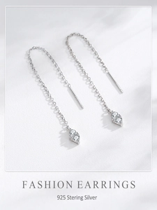 Close-up of S925 sterling silver hallmark on teardrop tassel earrings with cubic zirconia