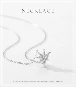 Macro shot of silver S925 star pendant necklace with sparkling zircon stone inlay