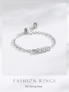Macro detail of S925 sterling silver chain ring with zircons and adjustable bead slide